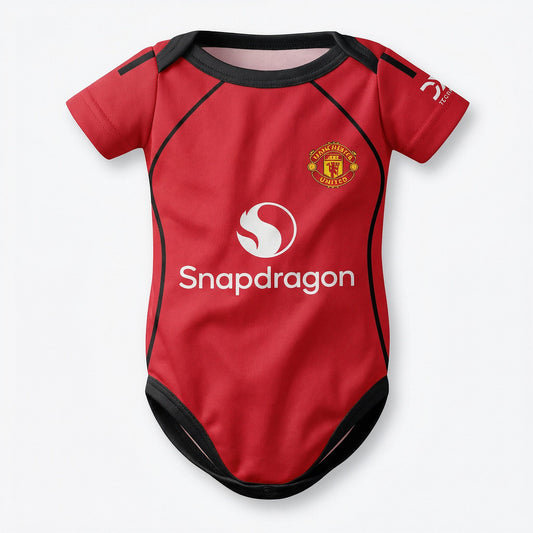 Manchester United 25/26 baby bodysuit front view with Snapdragon logo and club crest