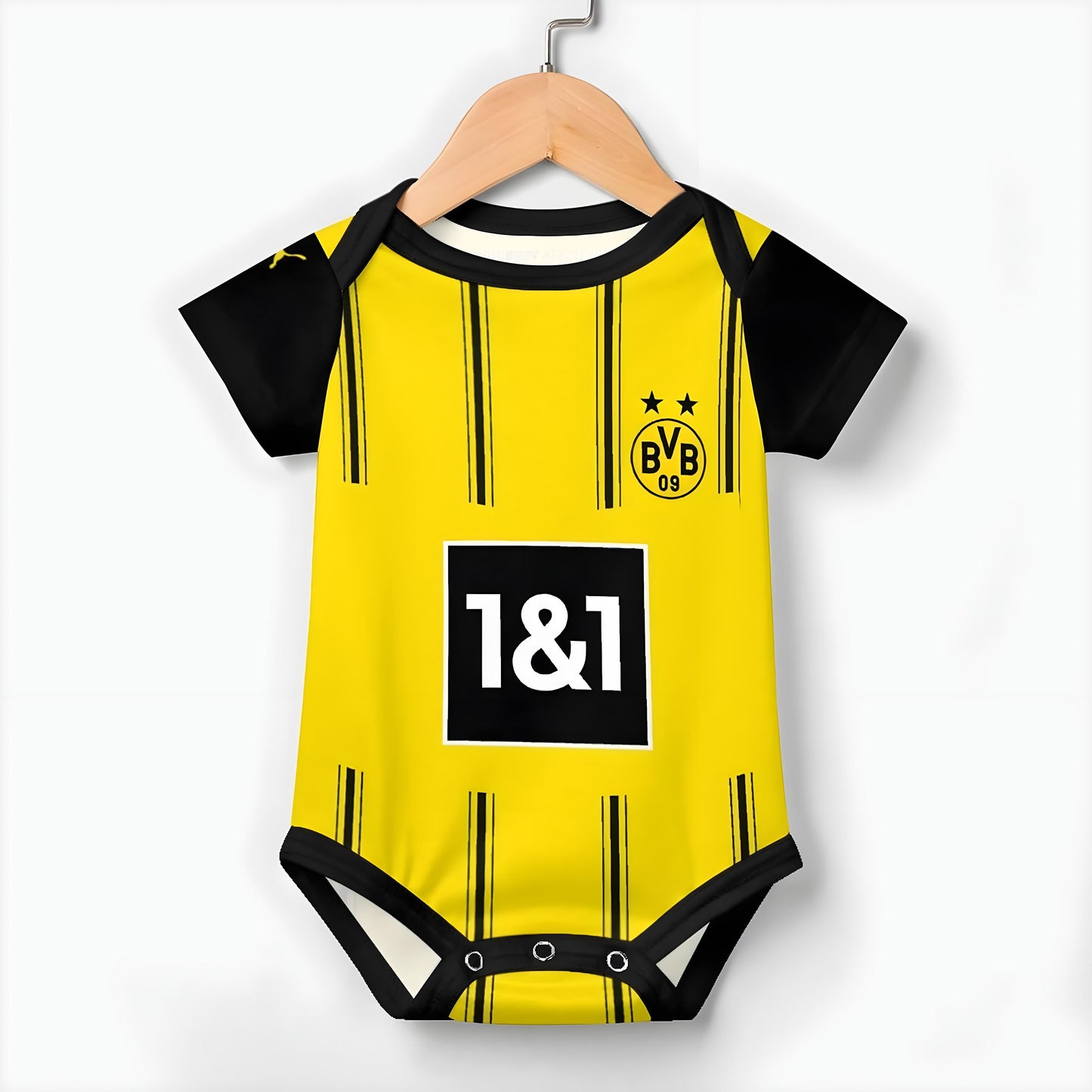 Borussia Dortmund baby onesie hanging on a hanger against a white backdrop