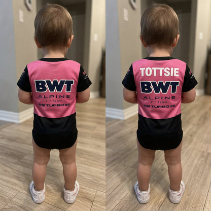 toddler wearing BWT Alpine F1 baby bodysuit back view - plain vs personalized name print comparison