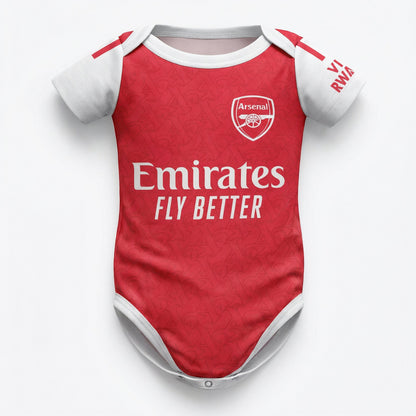 Arsenal 25/26 baby bodysuit front view red kit with Emirates Fly Better sponsor and cannon crest