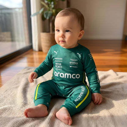 baby sitting down wearing aston martin jumpsuit
