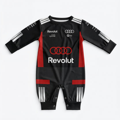 Audi 2026 baby racing onesie front view in black with red accents Audi rings and Revolut logo