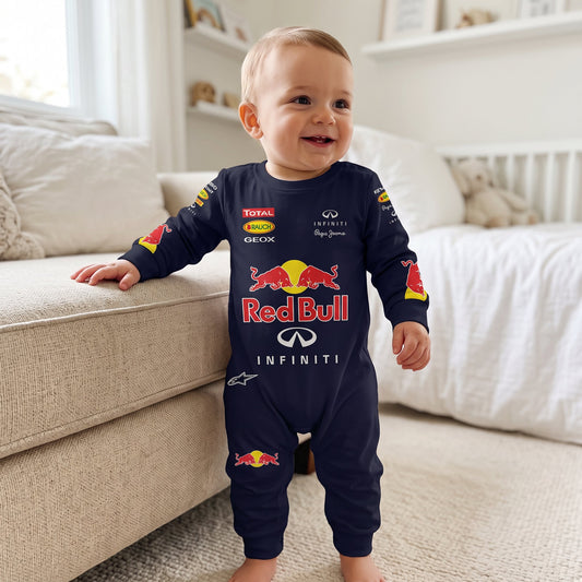 Smiling baby wearing Red Bull Vettel era racing onesie jumpsuit standing by couch in nursery