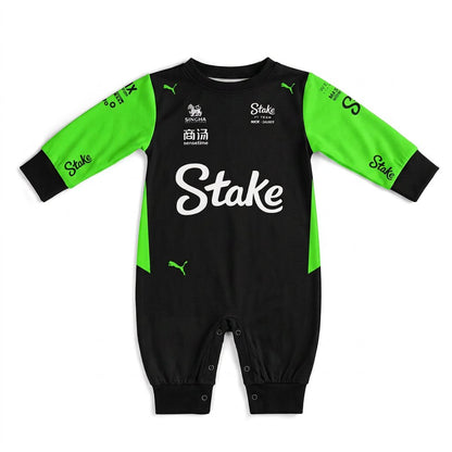 Stake Kick 2025 baby jumpsuit onesie front view black green with white Stake logo and sponsor patches
