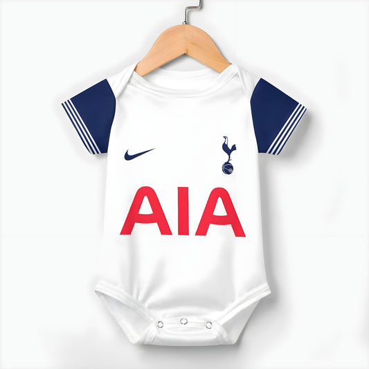tottenham spurs baby onesie front hanging on a hanger on white background