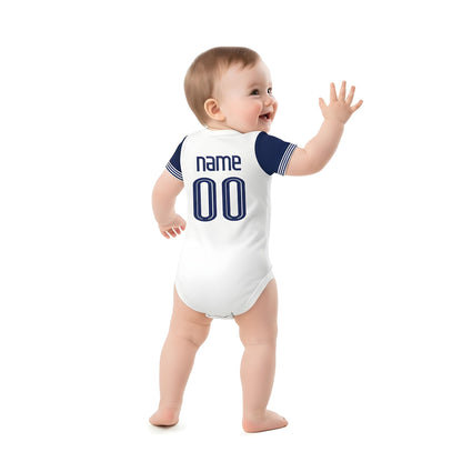 baby wearing a personalzied tottenham hotspur onesie backshot on white backdrop